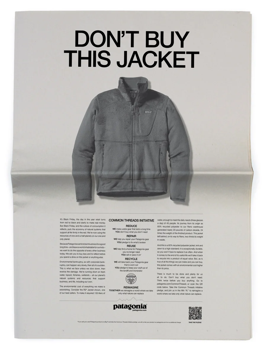 Patagonia print advertisement showing a grey fleece jacket with the bold headline DONT BUY THIS JACKET, part of the brands Common Threads sustainability campaign.