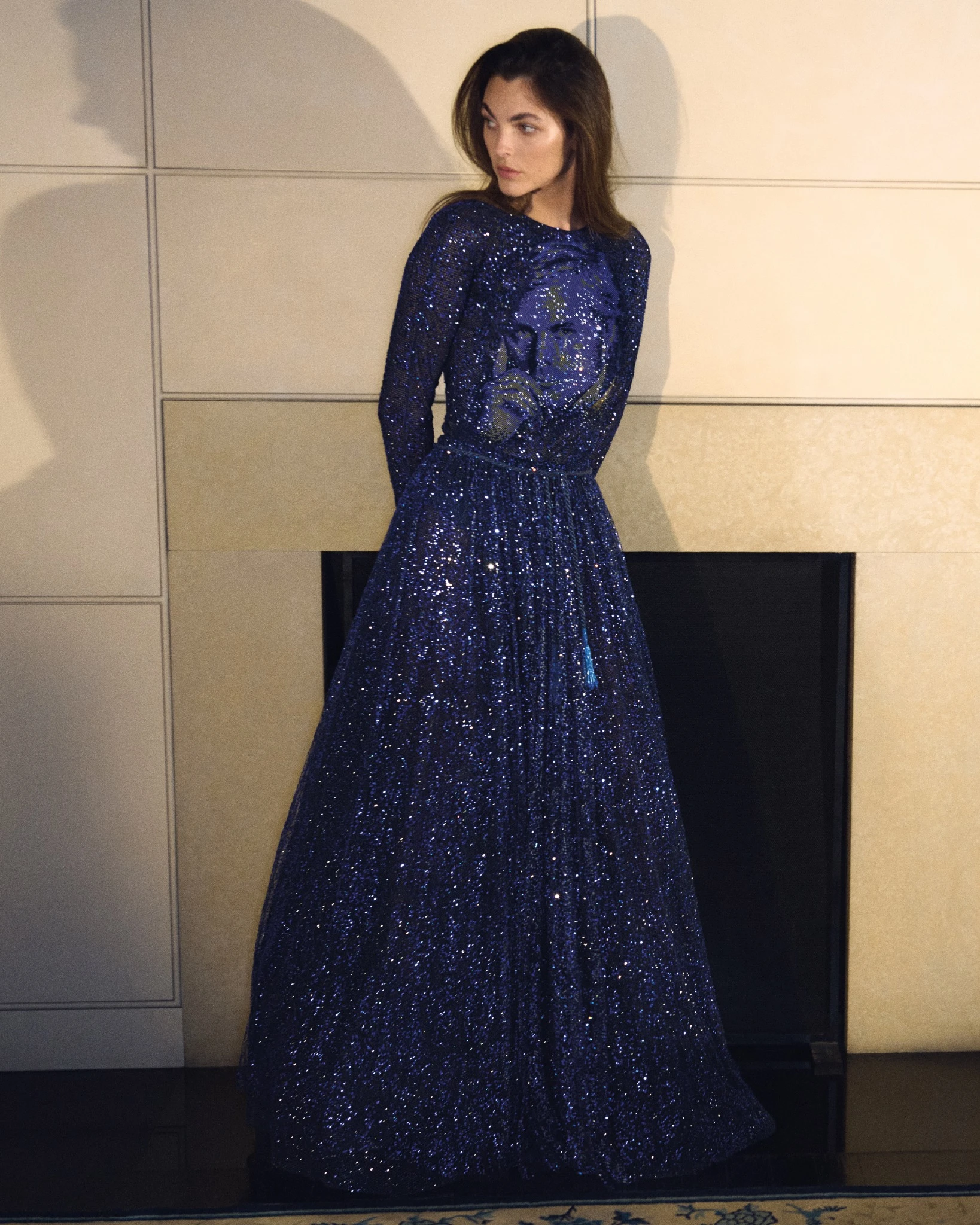Vittoria Ceretti photographed for the Giorgio Armani Spring Summer 2026 campaign, wearing a deep blue sequined evening dress inside the designer’s Milan residence