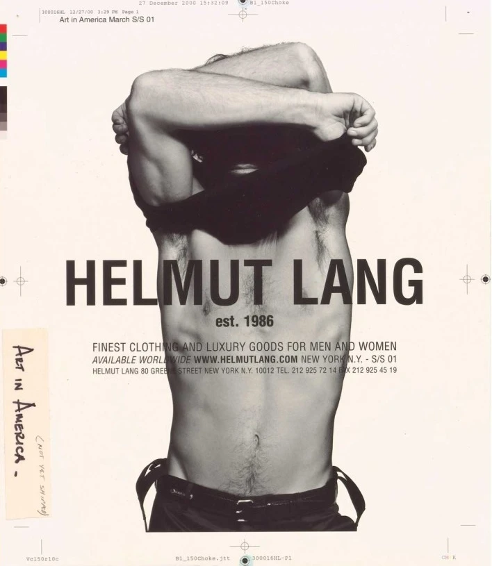 Helmut Lang Art in America advertisement from 2001 featuring a black and white photographic image of a male torso with arms crossed over the head, from the MAK Helmut Lang Archive