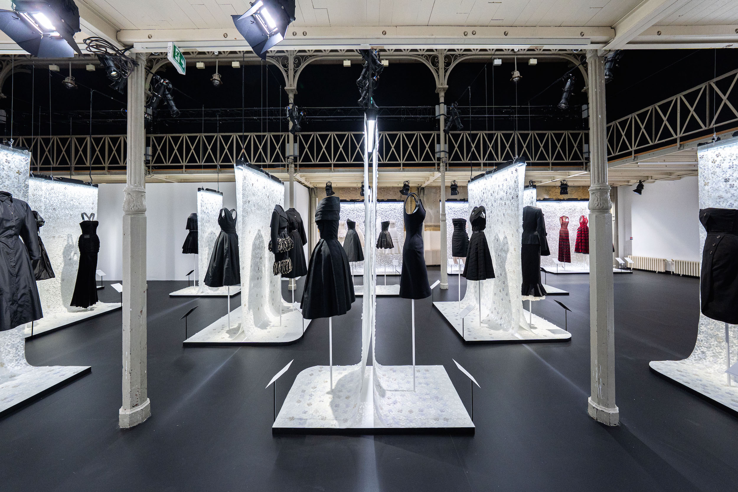 Azzedine Alaia Foundation exhibition displaying iconic black dresses on mannequins, Paris