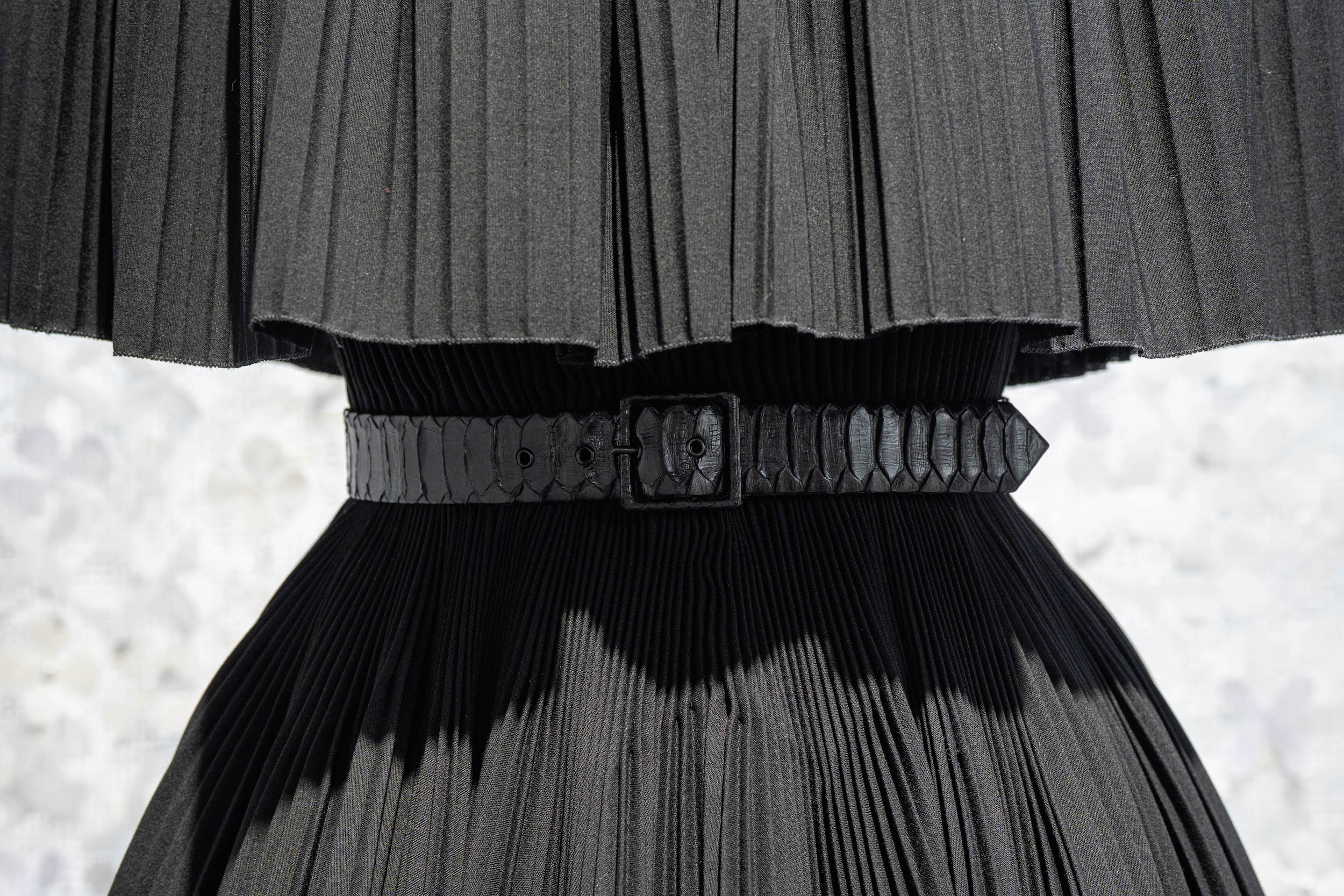 Black pleated dress with snakeskin belt from Azzedine Alaia and Christian Dior haute couture exhibition