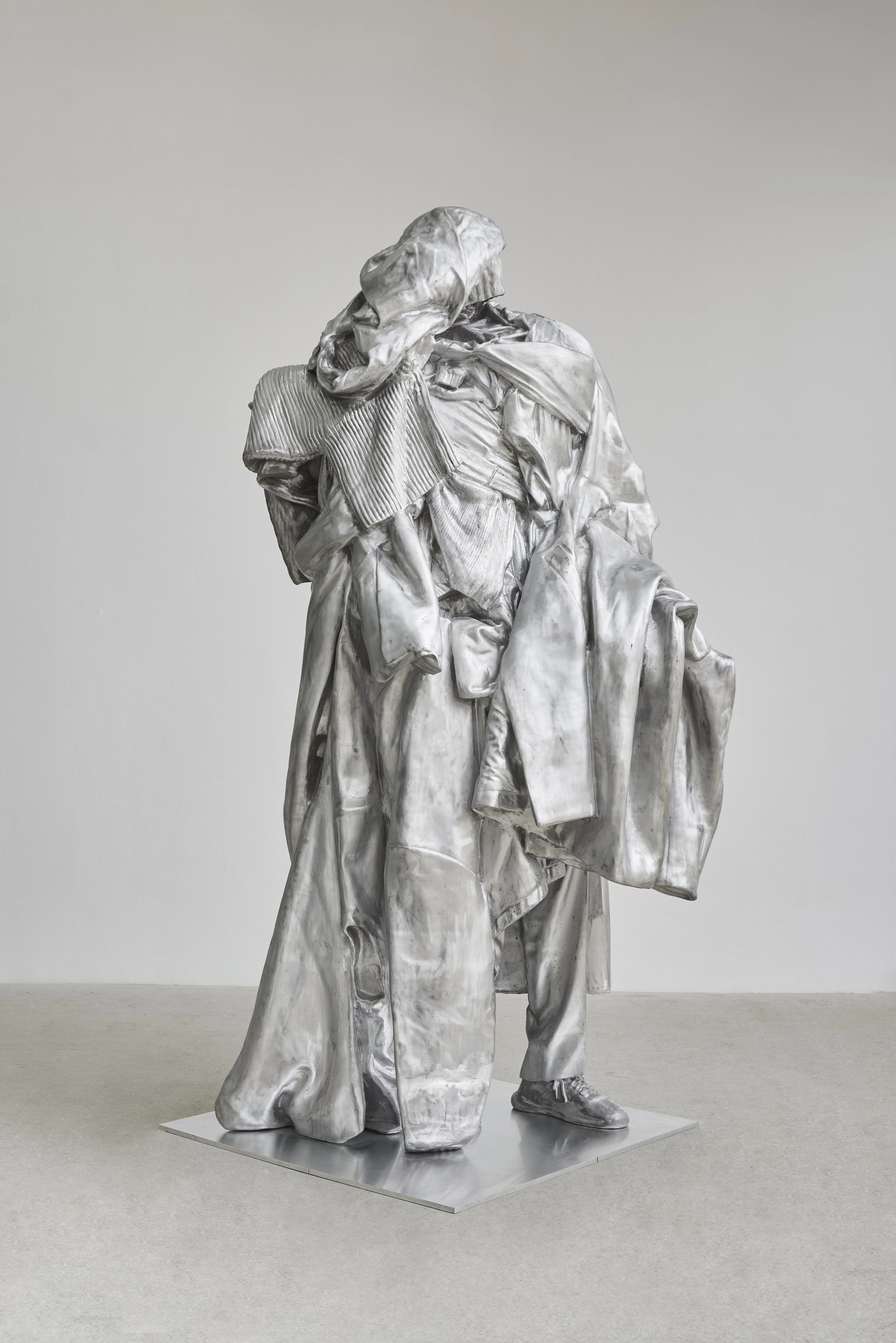 Erwin Wurm aluminum sculpture of figure layered in clothing at Fortuny Museum Venice