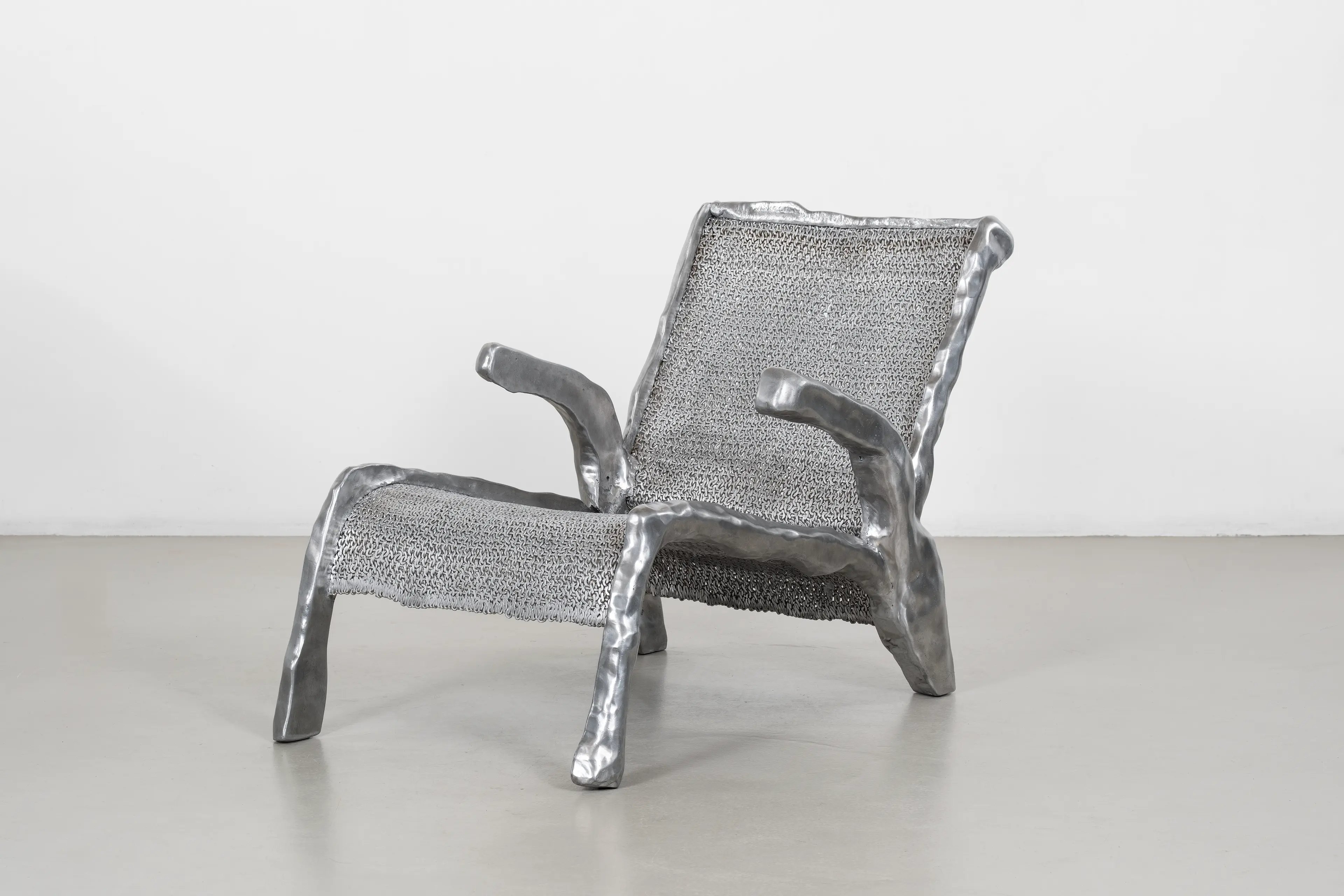 Nicolas Zanoni sculptural cast aluminum lounge chair with chain mail mesh seat and back