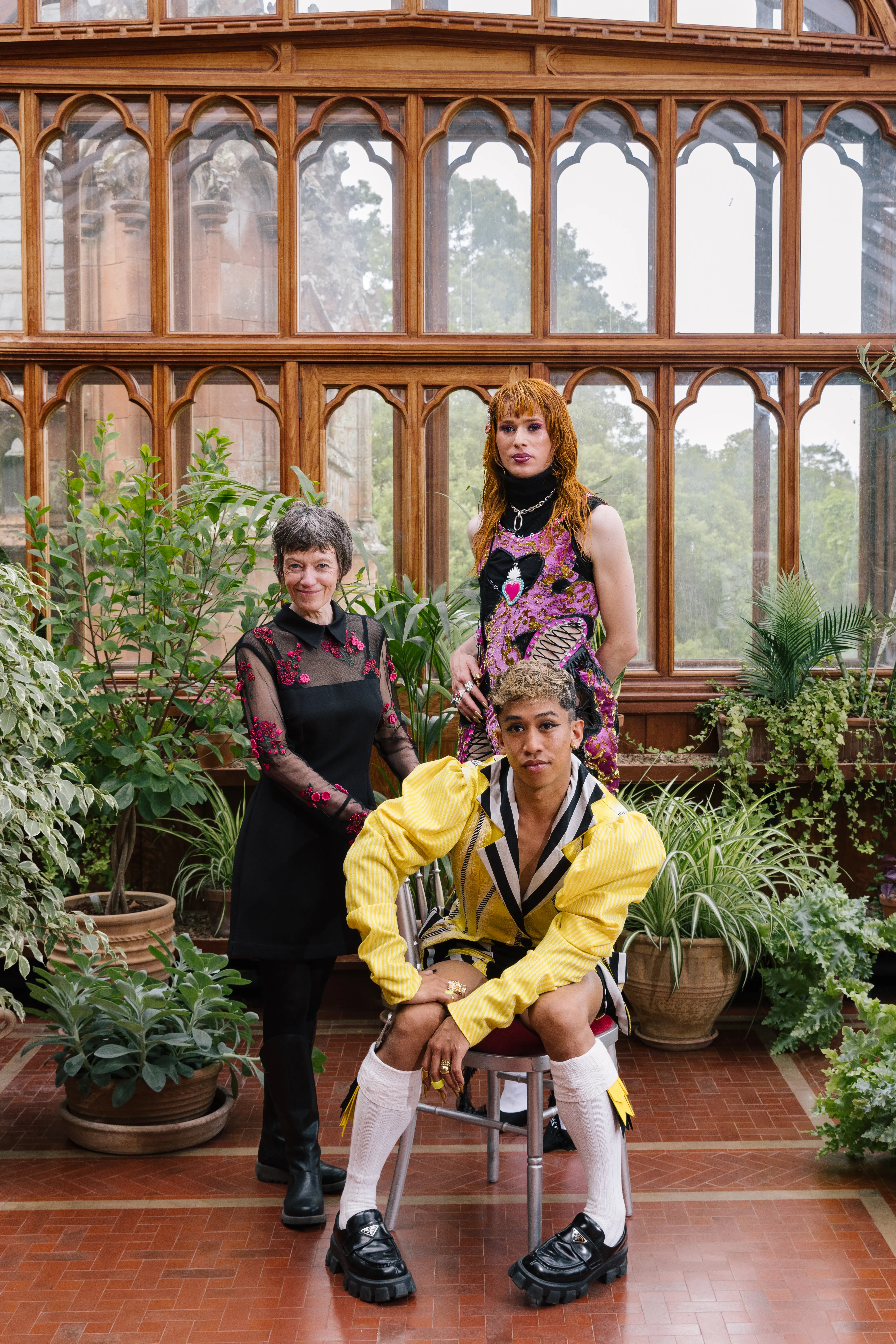 Davide Bugarin, Angel Cohn Castle, and Morven Gregor posing in Mount Stuart conservatory, Scotland