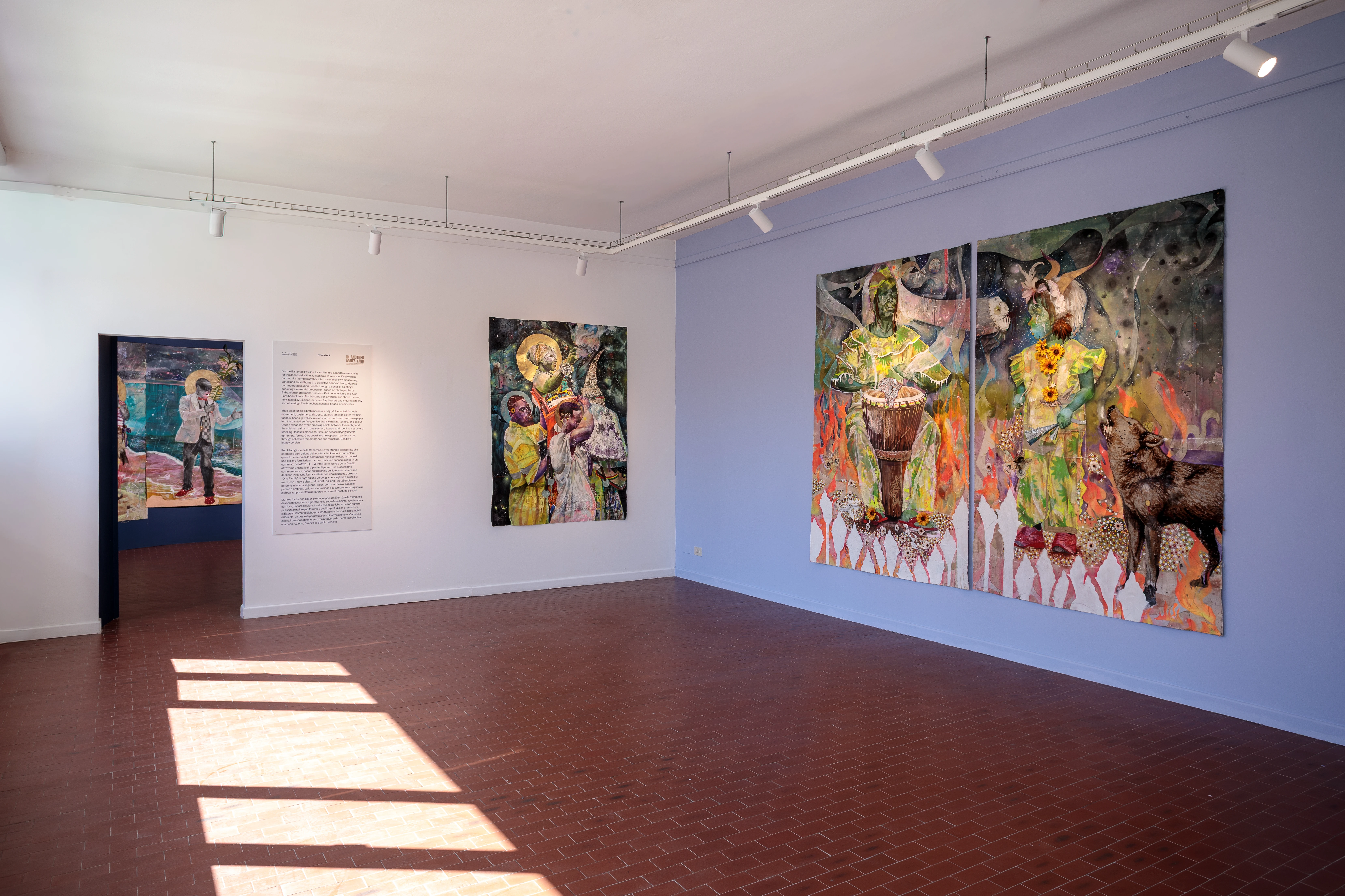Bahamas Pavilion installation view with vibrant figurative paintings on gallery walls