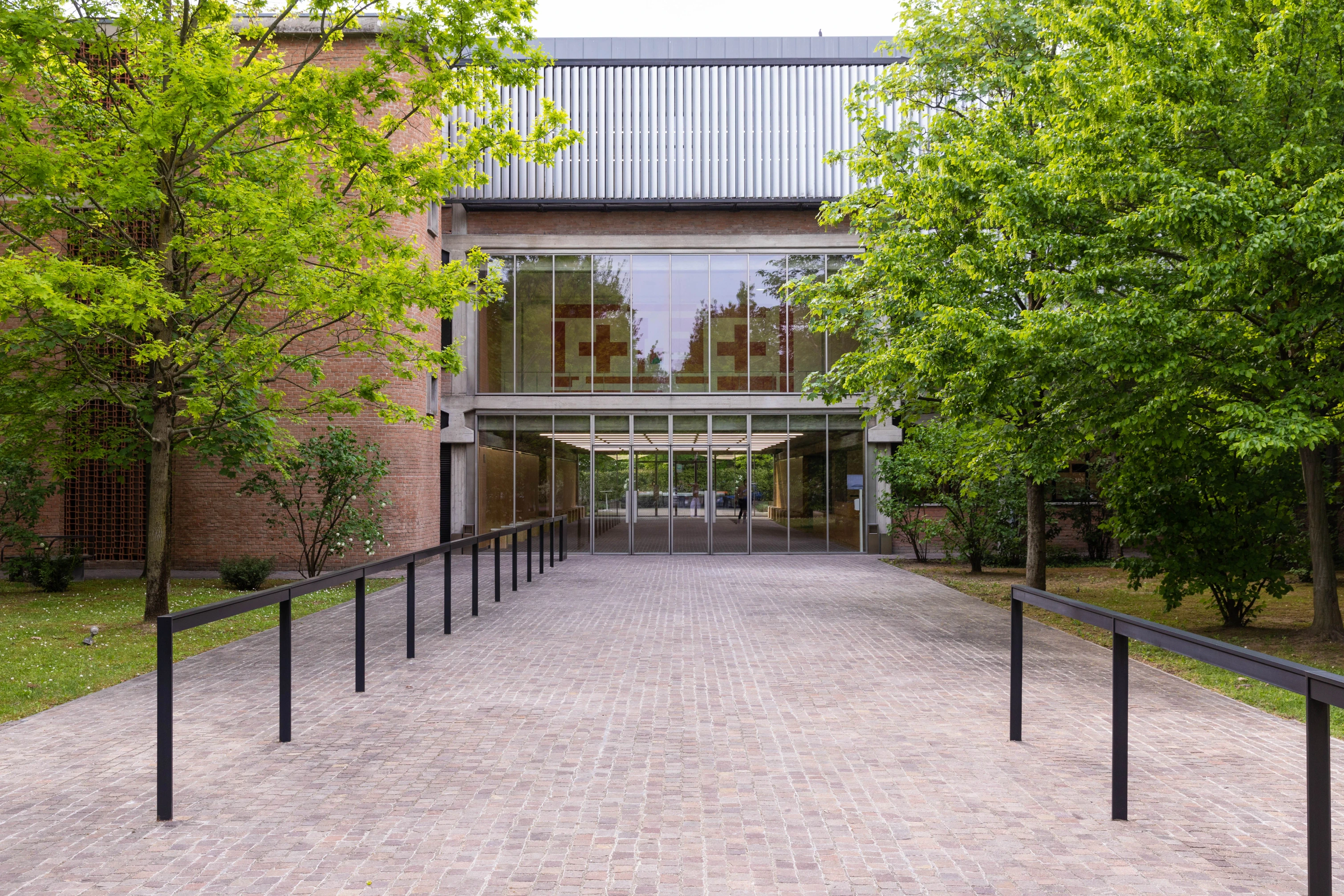 Collezione Maramotti art museum entrance with brick facade and glass atrium, Reggio Emilia Italy